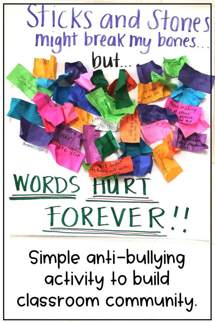 a bulletin board with words written on it and colorful sticky notes attached to the wall