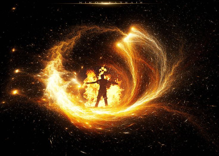 a person standing in the middle of a fire ball