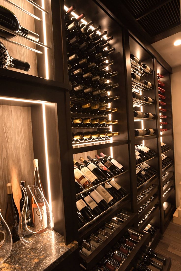 a wine cellar filled with lots of bottles