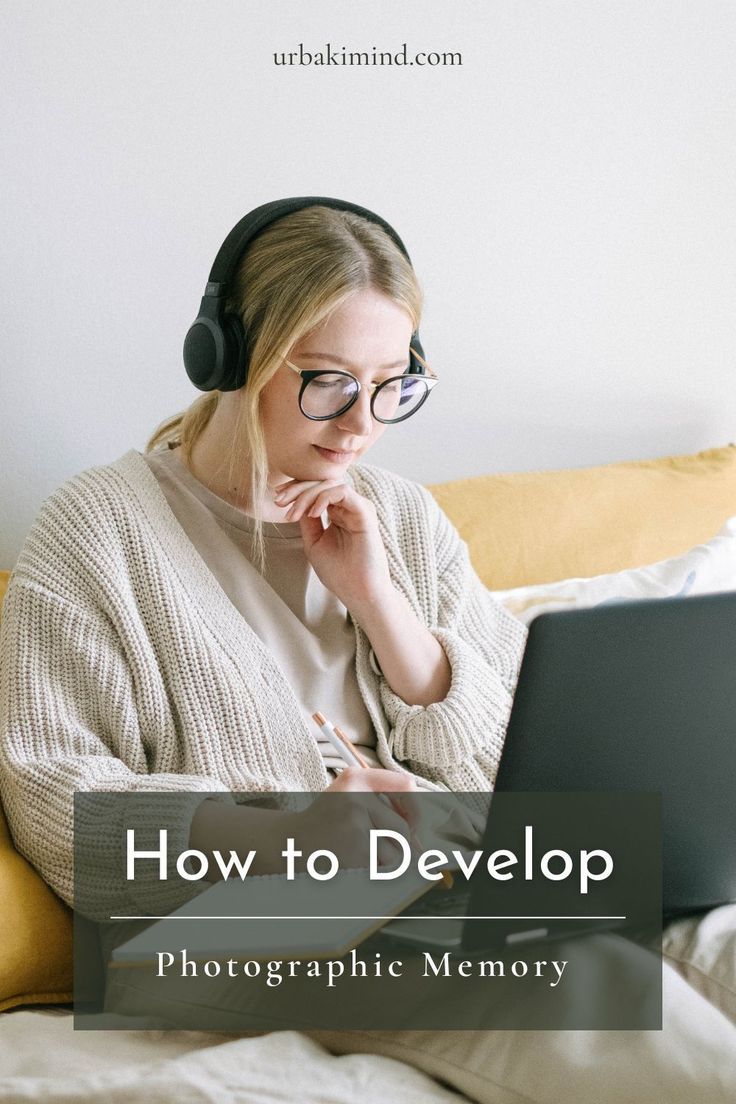 a woman wearing headphones and using a laptop