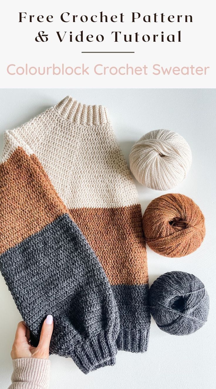 the color block crochet sweater is shown with two balls of yarn next to it