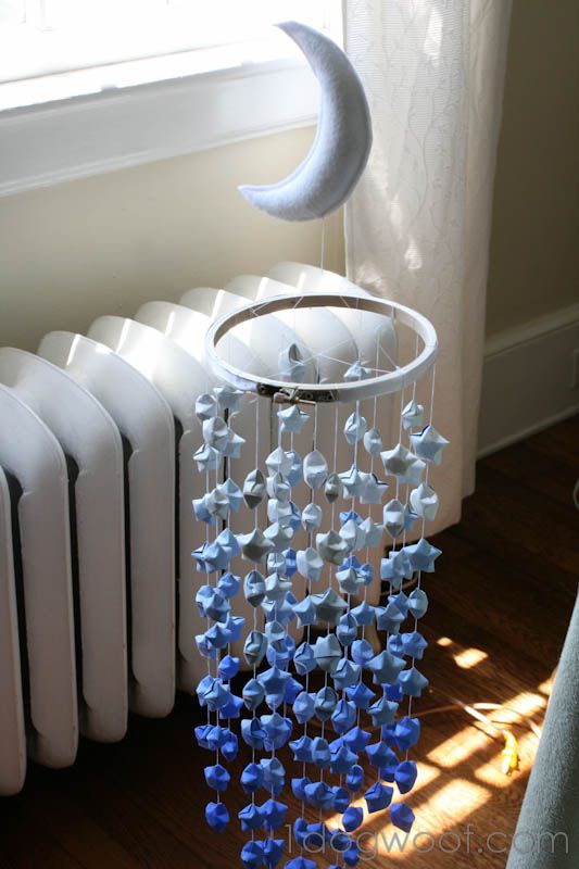 a wind chime hanging from the side of a radiator