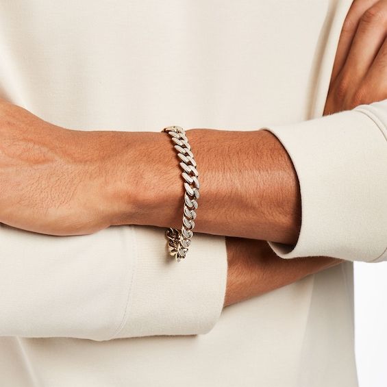 Make a confident statement of style with the 1-7/8 cts. t.w. of diamonds in this 10K gold curb chain bracelet for men. Fashioned in warm 10K gold Each curb link along the chain shines with two rows of diamonds. Captivating with 1-7/8 cts. t.w. of diamonds This 8.5-inch bracelet secures with a lobster claw clasp. Ideal Male Body, Mens Diamond Bracelet, Party Wear Gowns, Gold Curb Chain, Curb Chain Bracelet, Mens Gold Bracelets, Diamond Jewelry Designs, Bracelet For Men, Mens Gold