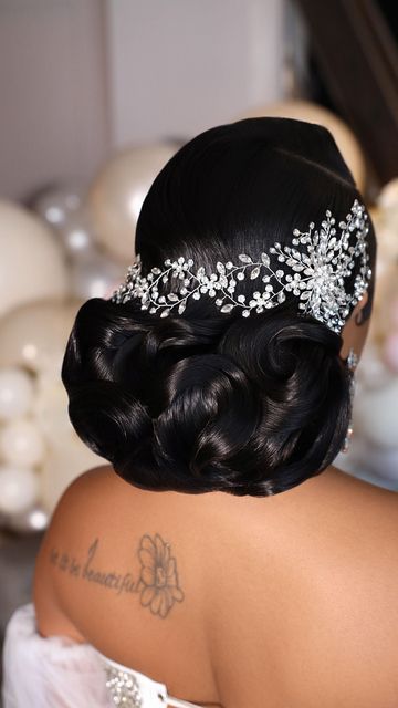 the back of a woman's head wearing a tiara