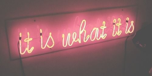 a neon sign that says it is what it is