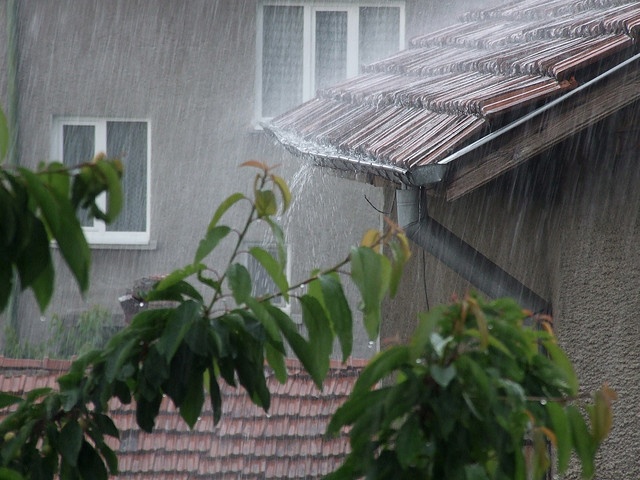 the rain is coming down from the roof