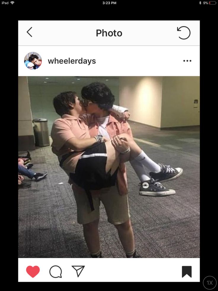 two people hugging each other in an airport