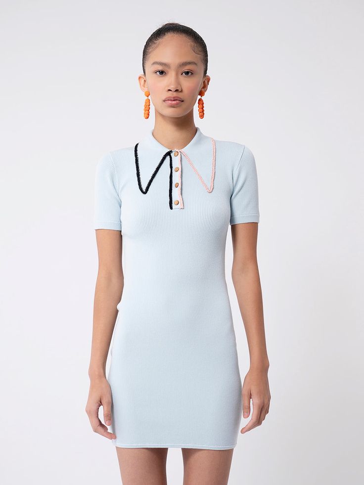 She's back and she's an undeniable staple: the ribbed mini polo dress for summer, beautifully fitted and flattering for a sophisticated, retro-active silhouette. Knit in a sustainable viscose blend, with our signature 70s style collar, functional placket, four wooden buttons down the front and the PreFall23 raffia trim details. Gloss is a fine, lightweight yarn made from sustainable fibers; soft to the touch, sleek, with a little bit of a sheen to it. Gloss won’t pill or fade, but some colors, e Crystal Bay, Polo Shirt Dress, Style Makeover, Dress For Summer, 70s Style, Wooden Buttons, Button Dress, Trim Detail, Polo Dress