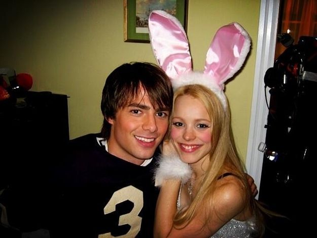 a man and woman in bunny ears posing for the camera