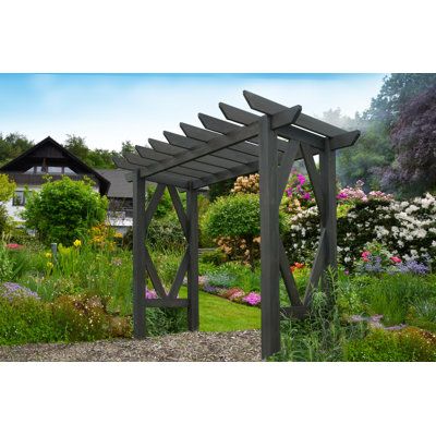 a wooden pergoline in the middle of a garden