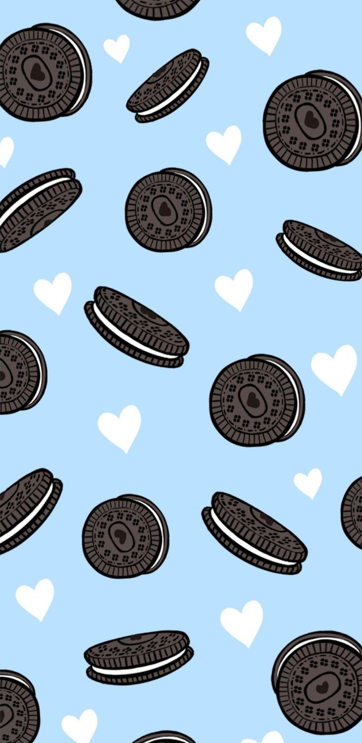 an oreo pattern on a blue background with hearts in the sky and two chocolate chip cookies