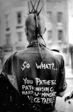 the back of a man's jacket with writing on it that says so what?