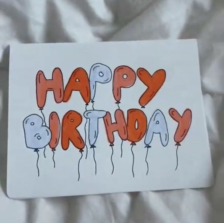 a happy birthday card with orange balloons and the words happy birthday written in red on it