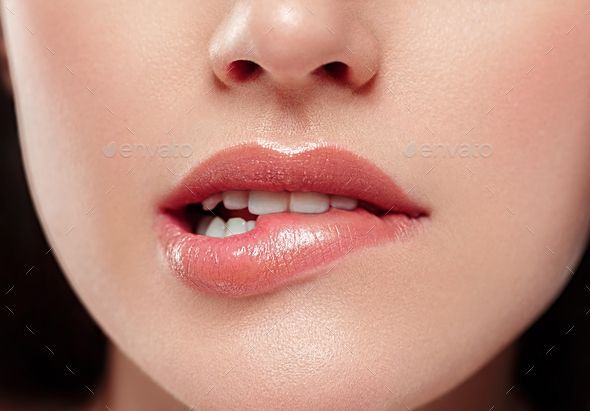 a woman's face with red lipstick and white teeth - stock photo - images