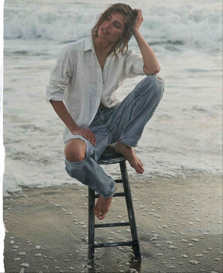 Jeans On Beach Photoshoot, Jeans In Water Photoshoot, White Shirt And Blue Jeans Photoshoot, Beach Clothes Photoshoot, Beach Stool Photoshoot, Oversized Shirt Photoshoot Ideas, White Shirt Beach Photoshoot, Jeans And White Top Photoshoot, Jean Beach Photoshoot