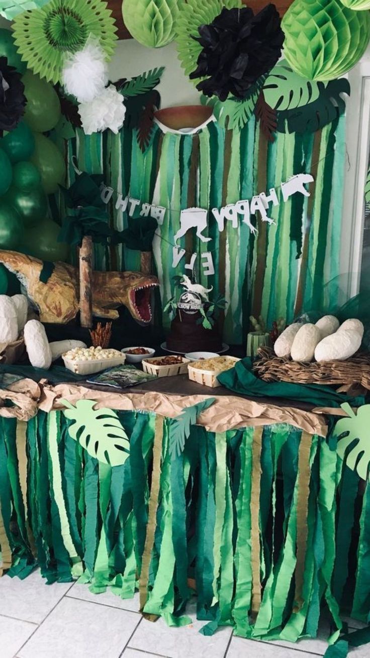 a table topped with lots of green decorations