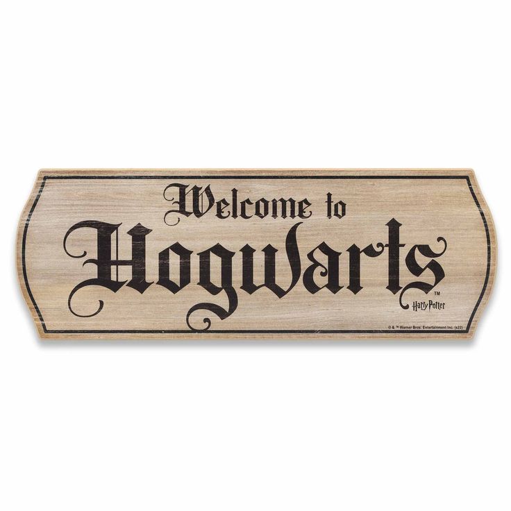 a wooden sign that says welcome to hogwarts