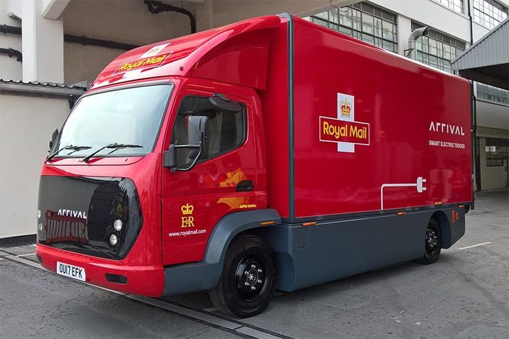 a red truck parked in front of a building