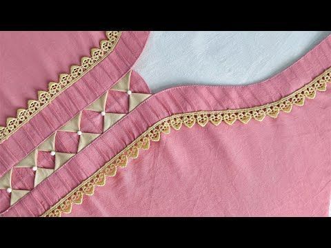 a pink dress with gold trims on it