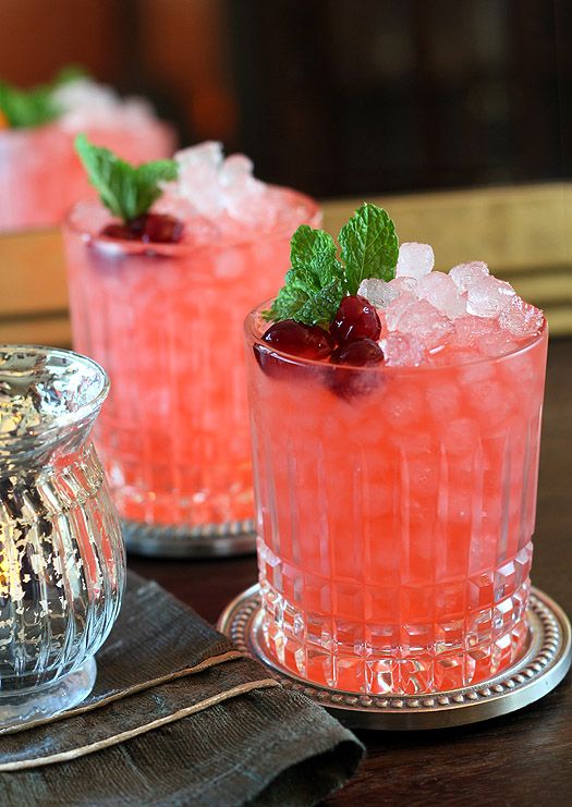 two glasses filled with cranberry ginger fizz