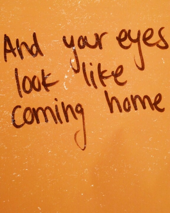 graffiti written on the side of a yellow toilet seat with words that read and your eyes look like coming home
