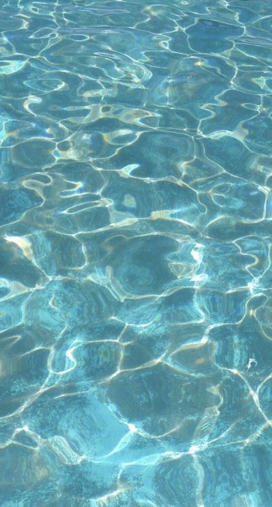 the water is very clear and blue with some ripples on it's surface