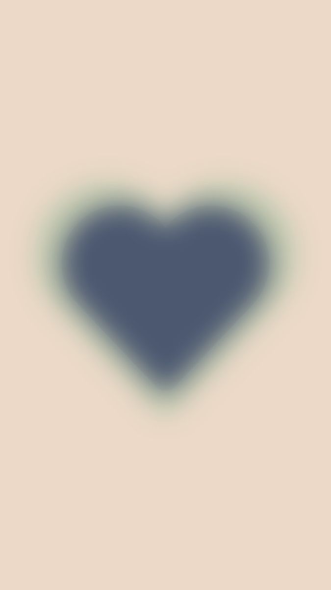 a blue heart shaped object in the middle of a beige background with an area that appears to be smogged