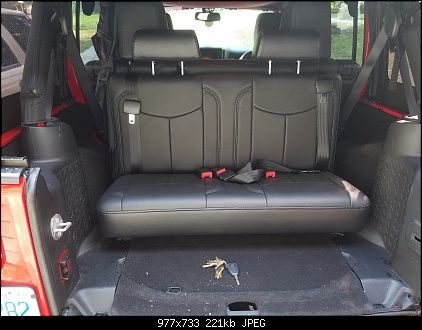 the back seat of a vehicle with seats folded down
