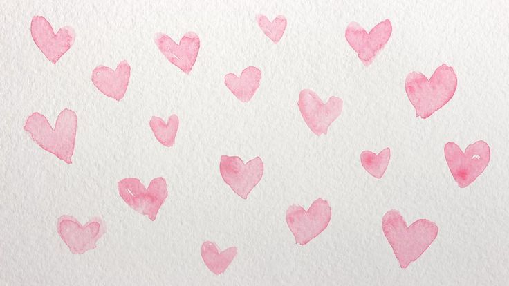 pink watercolor hearts drawn on white paper