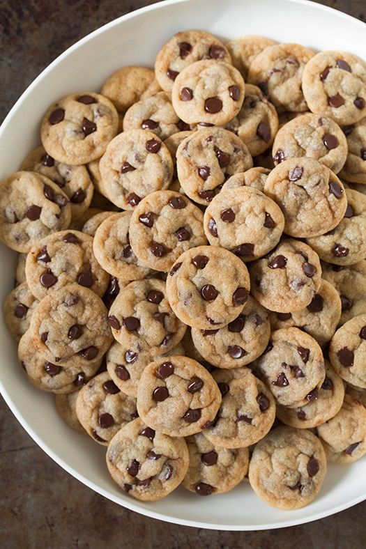 a white bowl filled with chocolate chip cookies