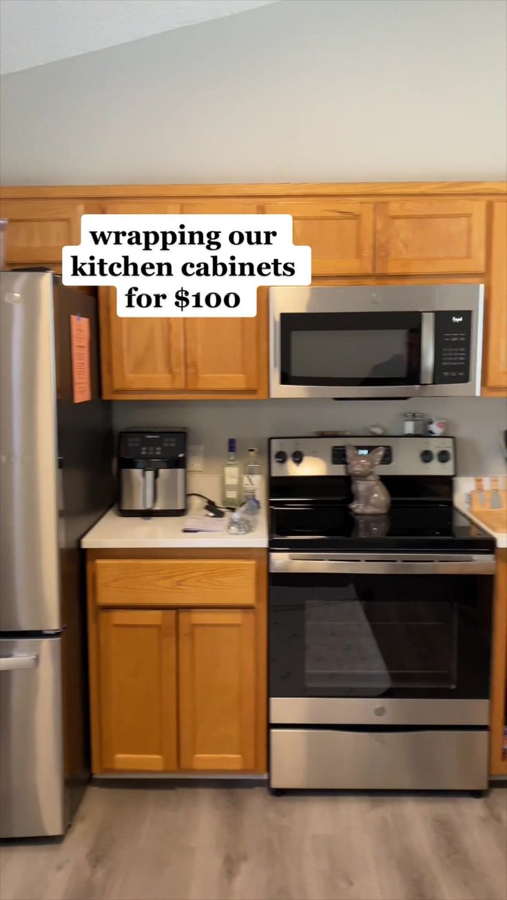 a kitchen with stainless steel appliances and wood cabinets