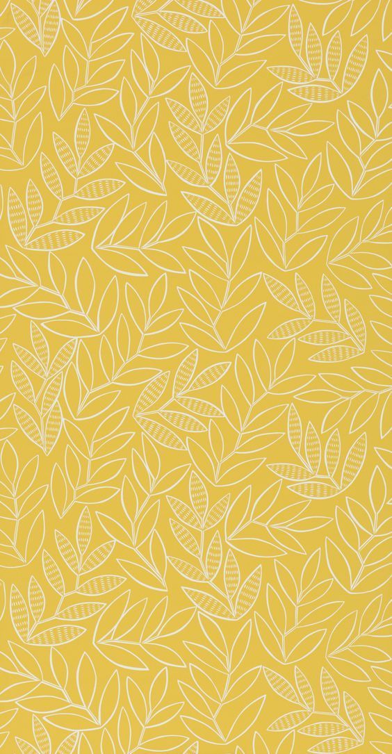 a yellow background with white leaves on it