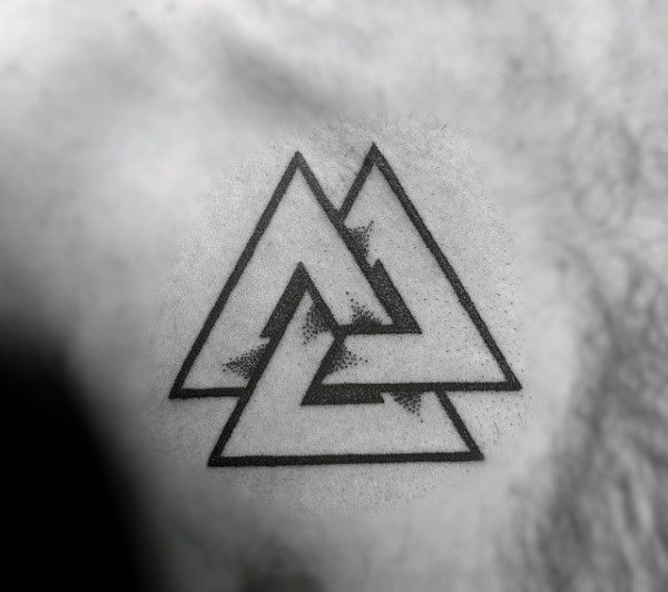 a man's arm with a triangle tattoo on the left side of his neck