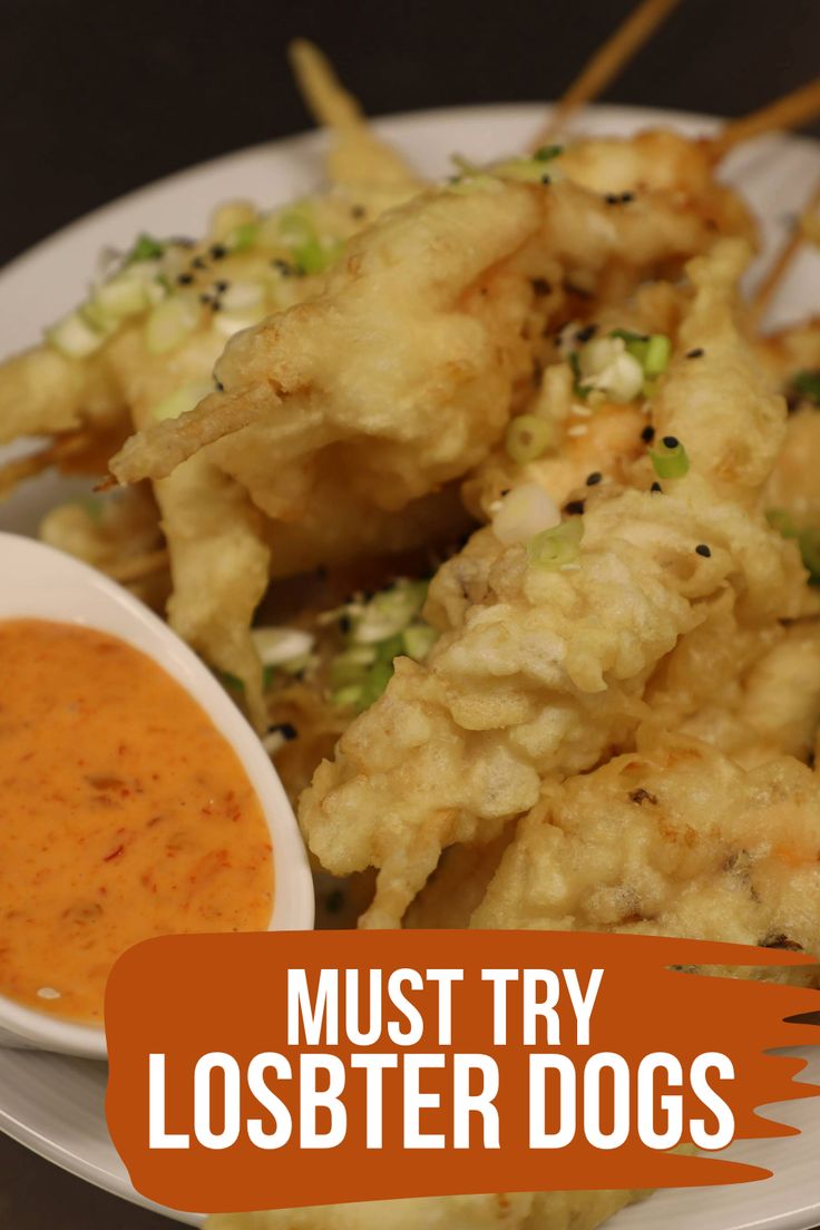 a white plate topped with fried food and dipping sauce