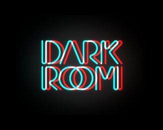 the words dark room written in neon lights