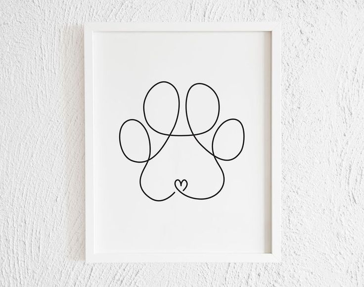 a black and white drawing of a dog's paw with a heart in the middle