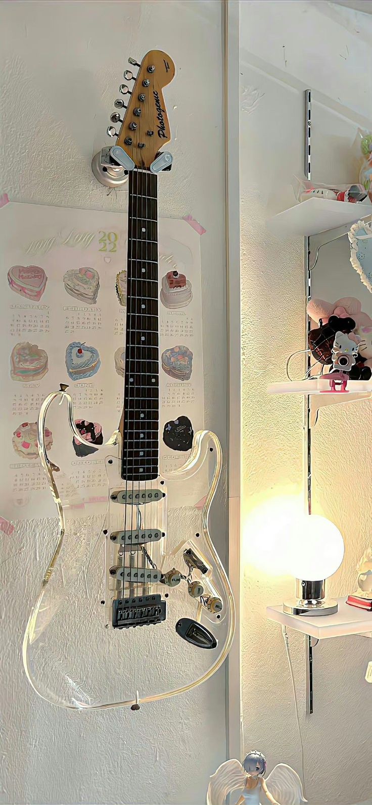 an electric guitar is hanging on the wall