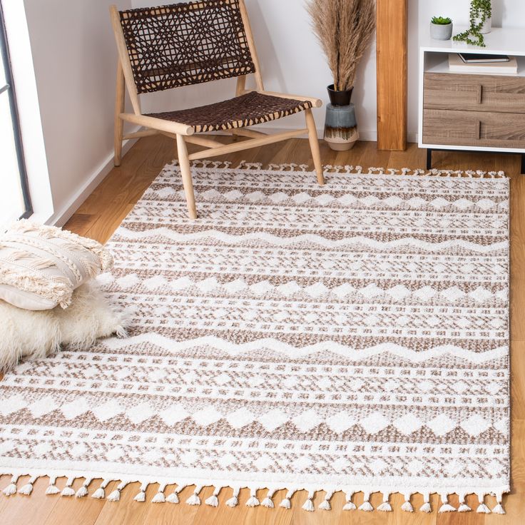 a white and brown rug in a living room next to a wooden chair with a plant on it