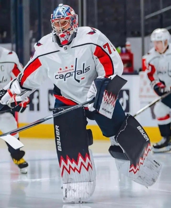 the goalie is ready to make his way down the ice during a hockey game