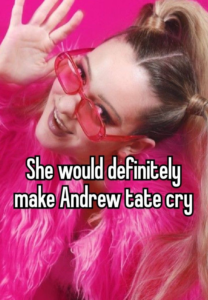 a woman with pink hair and glasses on her face is smiling at the camera she would definitely make andrews tate cry