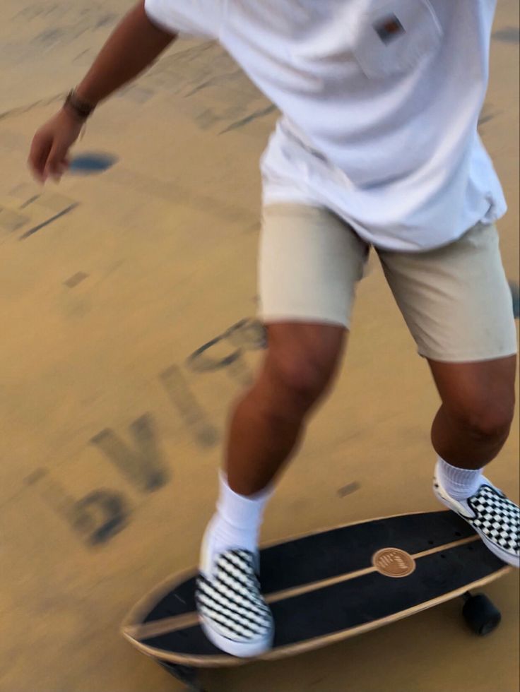 a man riding a skateboard down the side of a ramp