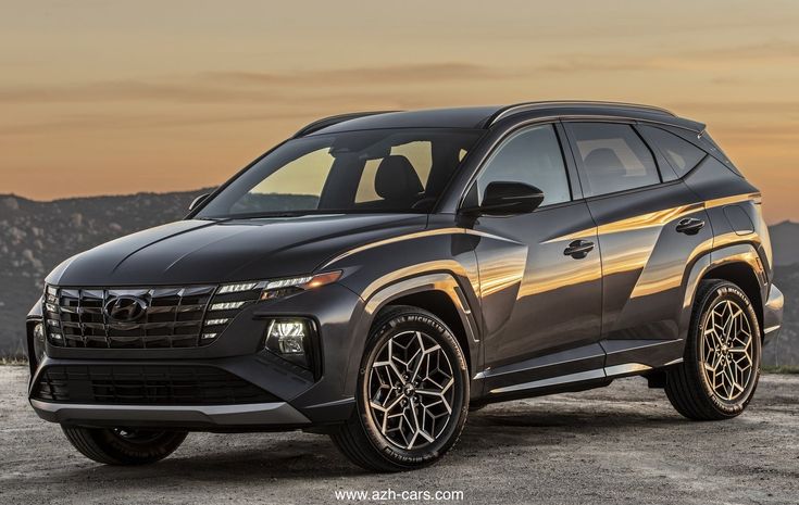 a gray suv parked on top of a mountain