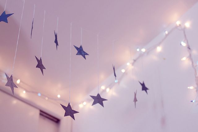 stars hanging from the ceiling in a room