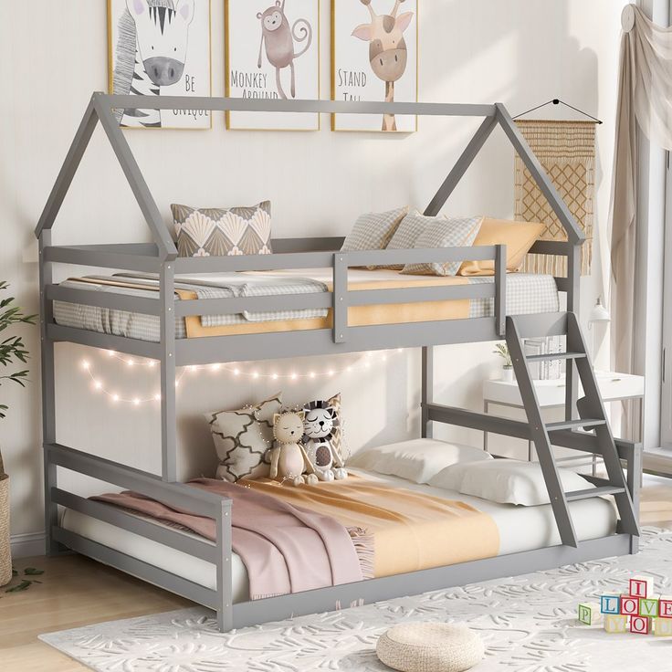 a child's bedroom with a bunk bed and lights on the bottom bunk, next to a window