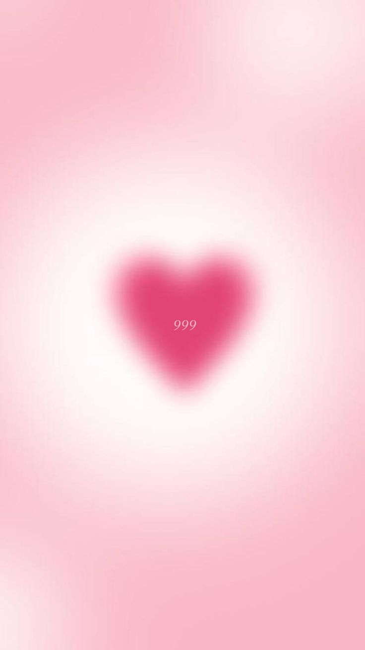 a pink heart shaped object in the middle of a blurry background with an overlay effect