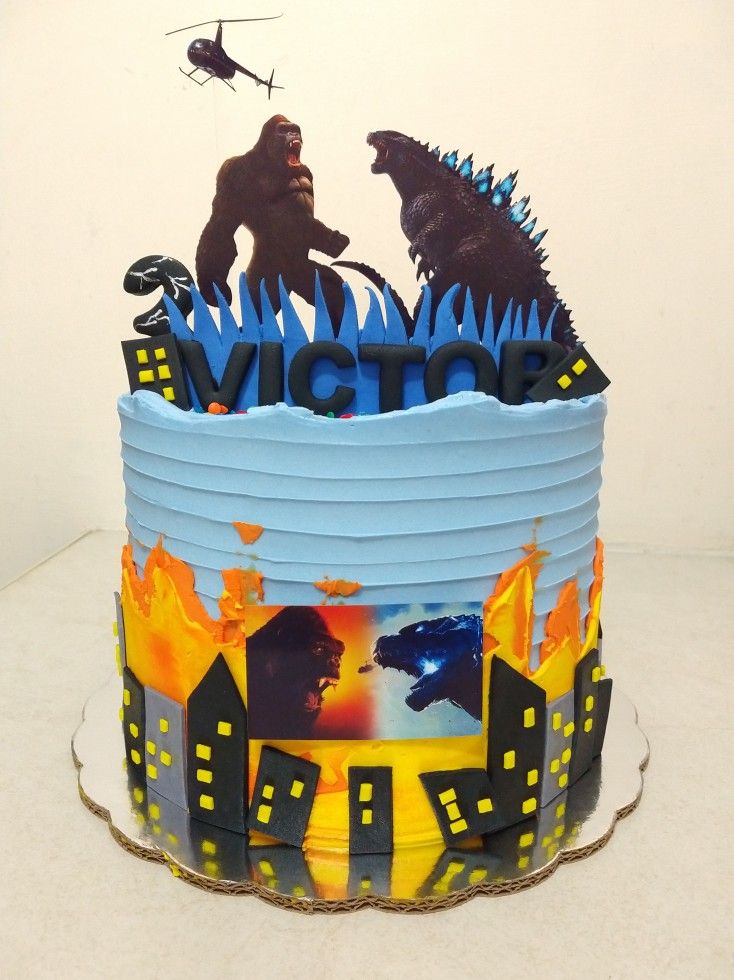 a birthday cake with godzillas on it