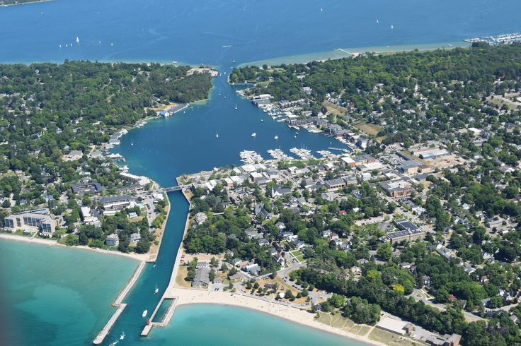 an aerial view of a small town and harbor