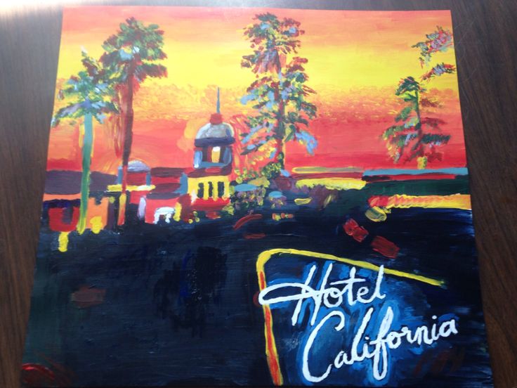 the hotel california sign is painted on a wooden surface with palm trees in the background