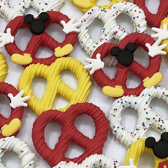 mickey mouse cookies are arranged in the shape of pretzels