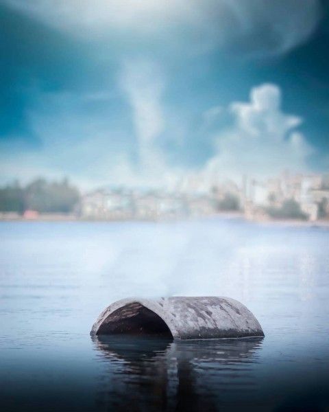 there is a rock in the middle of the water